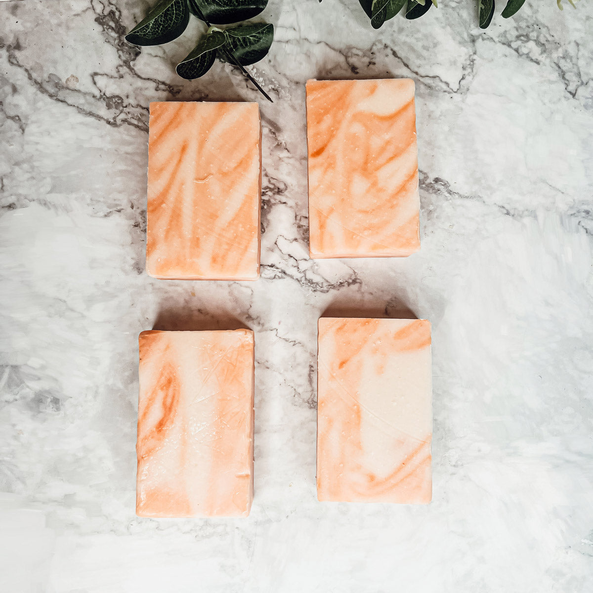 Summertime Citrus soap bar featuring vibrant colors of lime, lemon, and orange, handcrafted with organic ingredients.