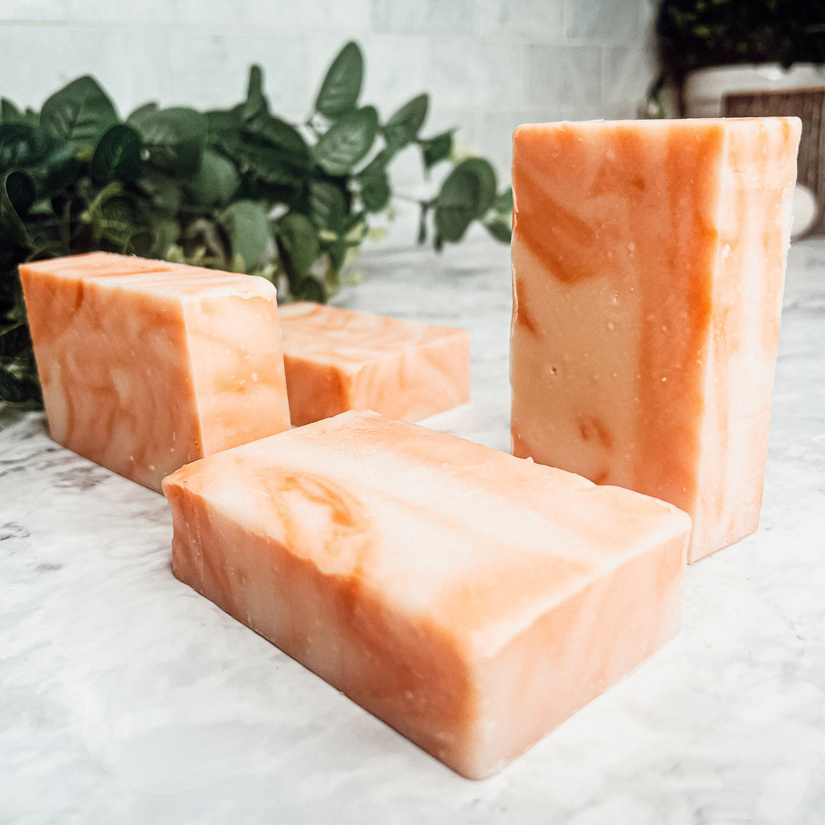 Summertime Citrus soap bar featuring vibrant colors of lime, lemon, and orange, handcrafted with organic ingredients.