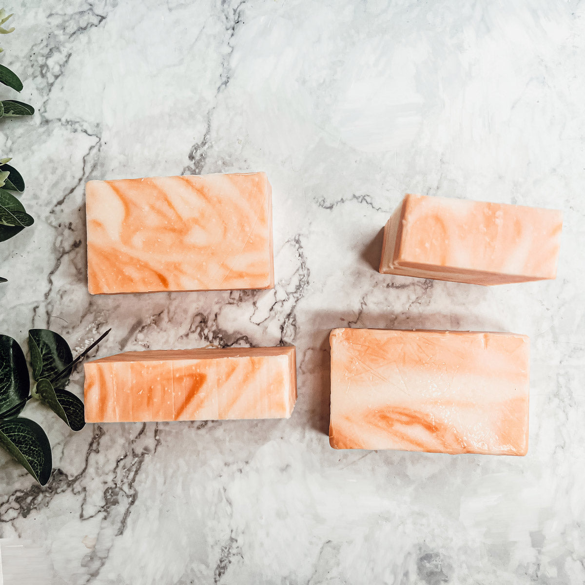 Summertime Citrus soap bar featuring vibrant colors of lime, lemon, and orange, handcrafted with organic ingredients.