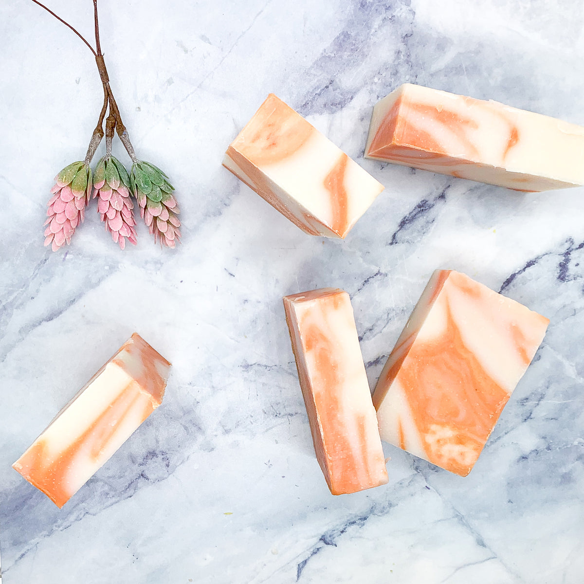 Summertime Citrus soap bar featuring vibrant colors of lime, lemon, and orange, handcrafted with organic ingredients.