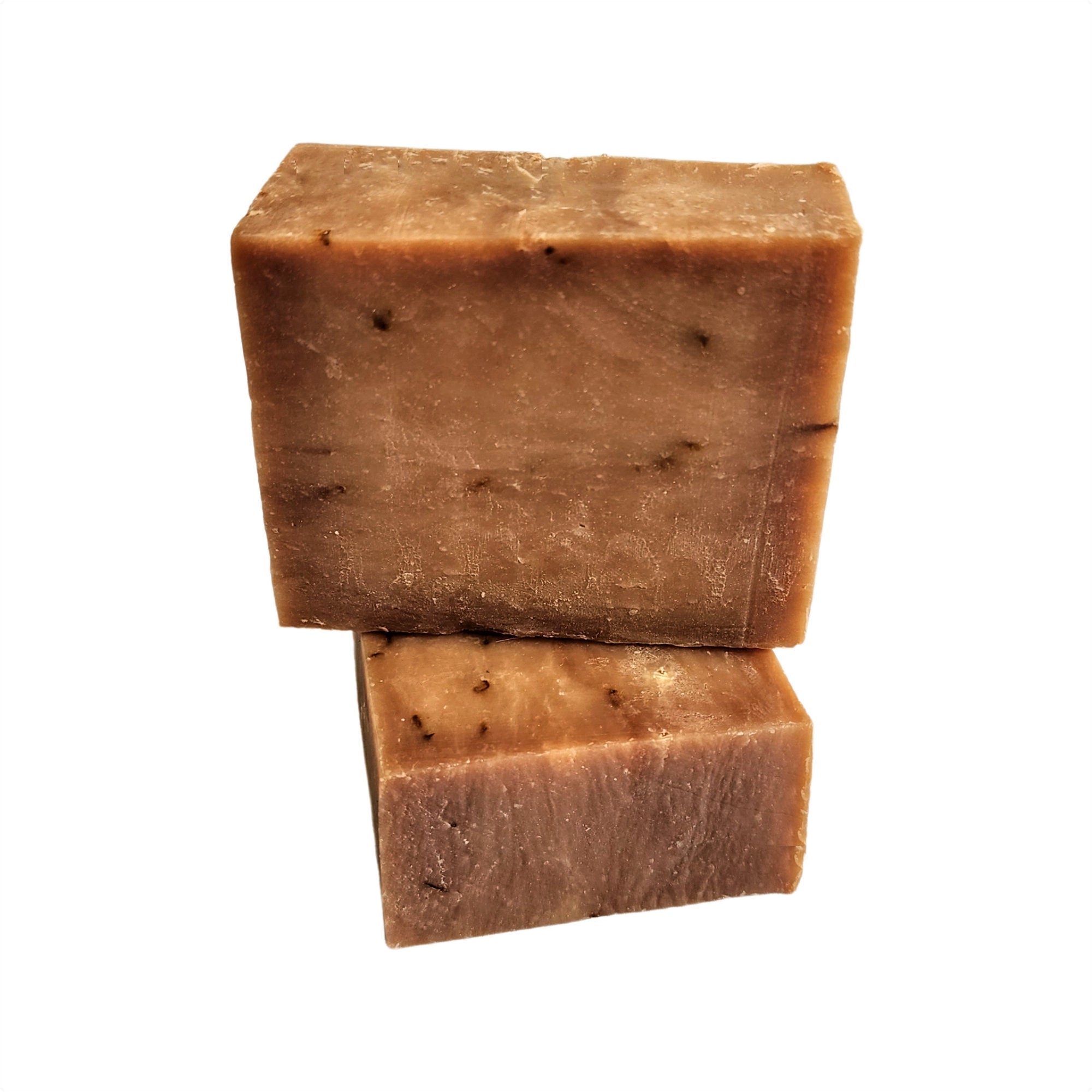 Sweet Tobacco Soap bar with a rich, alluring scent, handcrafted and vegan-friendly, displayed on a rustic wooden background.