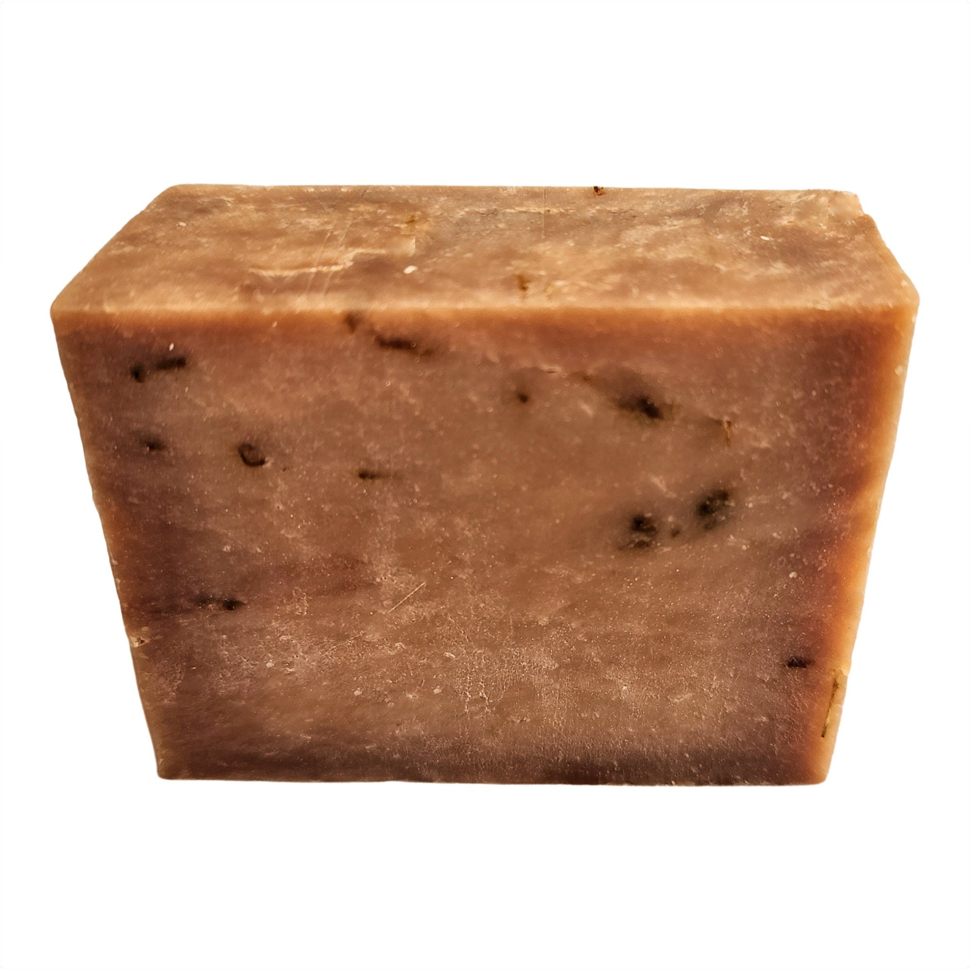 Sweet Tobacco Soap bar with a rich, alluring scent, handcrafted and vegan-friendly, displayed on a rustic wooden background.