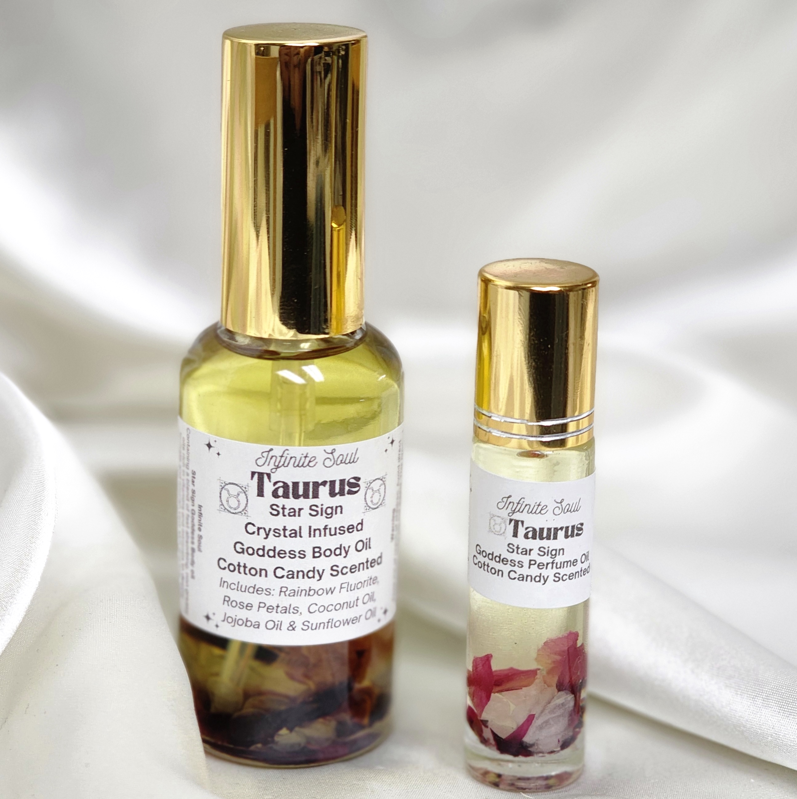 Taurus Star Sign Crystal Infused Goddess Body Oil with Fluorite chips and cotton candy scent, elegantly packaged.