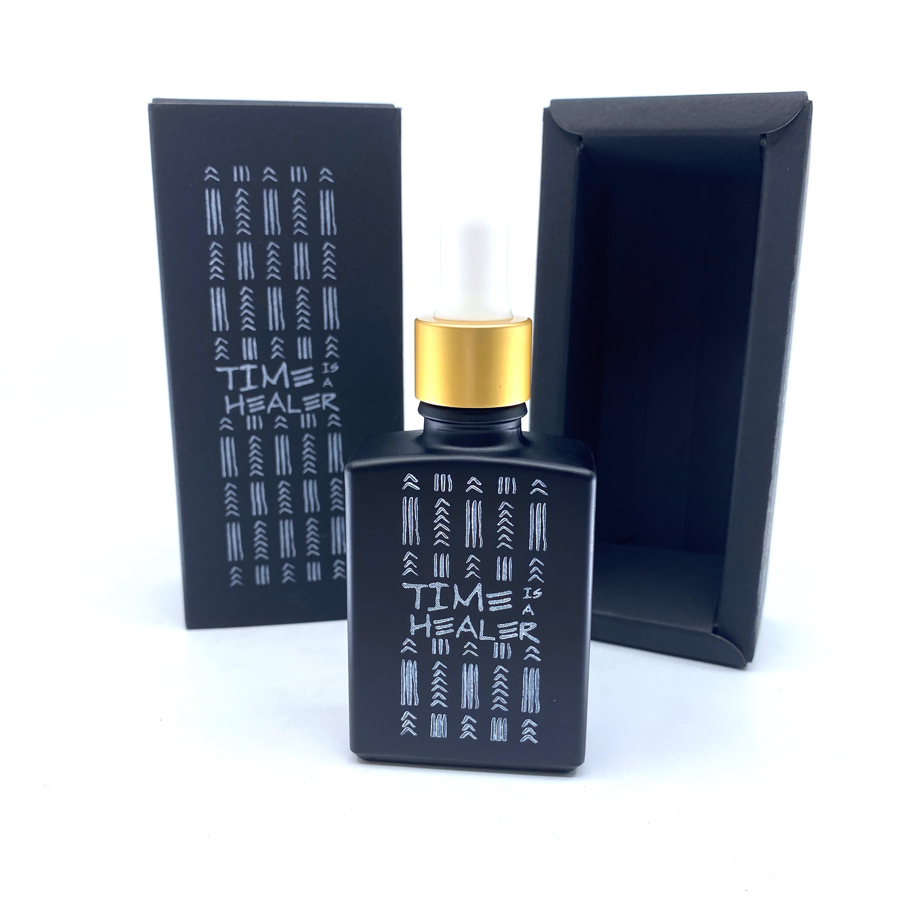 30 ml bottle of Time Is a Healer personal fragrance with a soothing coconut oil base, showcasing its elegant design and label.