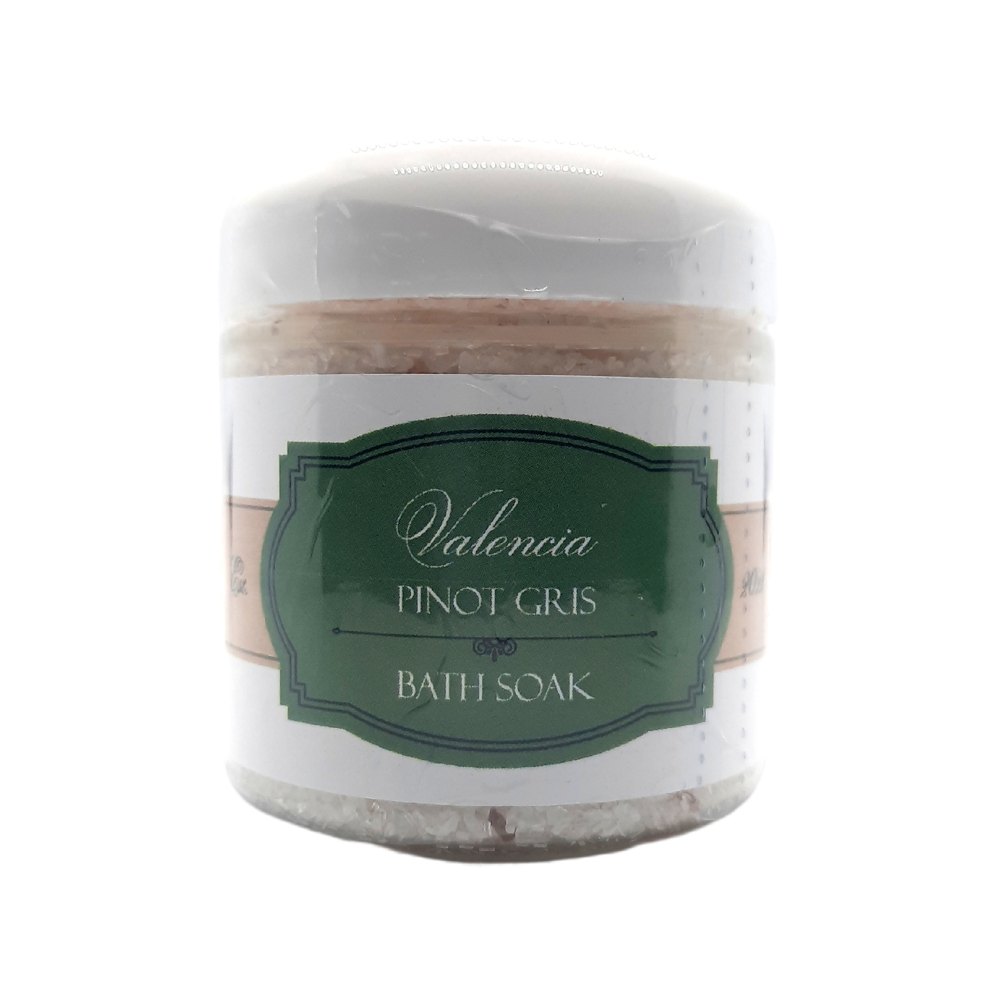 A luxurious bath soak featuring Valencia Pinot Gris, infused with organic wine, minerals, and citrus scents, in a clear jar with a wooden scoop.