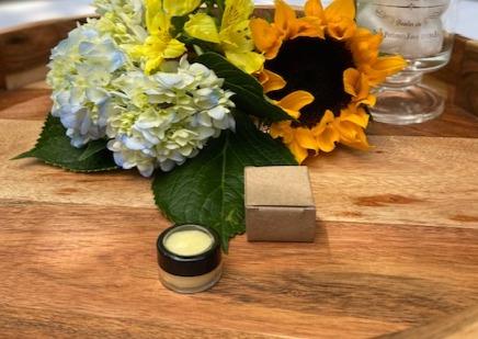 Vegan Refreshing Lip Balm in a sleek tube with a minty flavor, showcasing its natural ingredients.