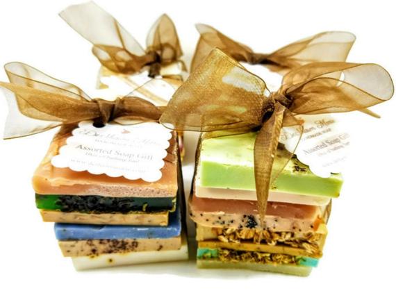 A beautifully arranged Vegan Soap Sampler featuring assorted slices of colorful soap loaf ends tied with a ribbon.