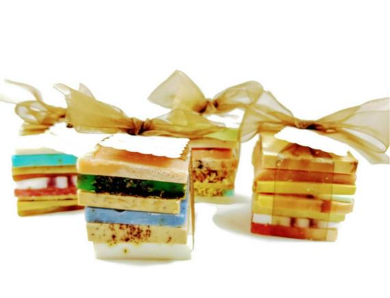 A beautifully arranged Vegan Soap Sampler featuring assorted slices of colorful soap loaf ends tied with a ribbon.