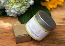 A jar of Vegan Whipped Mango Butter showcasing its creamy texture, ideal for hydrating sensitive skin areas.