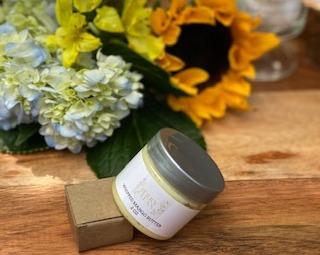 A jar of Vegan Whipped Mango Butter showcasing its creamy texture, ideal for hydrating sensitive skin areas.