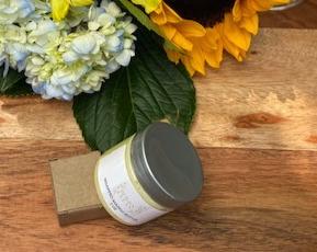 A jar of Vegan Whipped Mango Butter showcasing its creamy texture, ideal for hydrating sensitive skin areas.