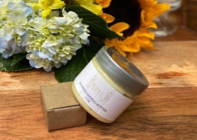 A jar of Vegan Whipped Mango Butter showcasing its creamy texture, ideal for hydrating sensitive skin areas.