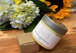 A jar of Vegan Whipped Mango Butter showcasing its creamy texture, ideal for hydrating sensitive skin areas.