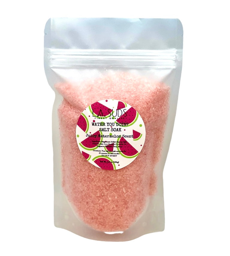 A vibrant package of Water You Doin? Watermelon Salt Soak, showcasing its fruity design and 6.5 oz size, perfect for a relaxing bath experience.