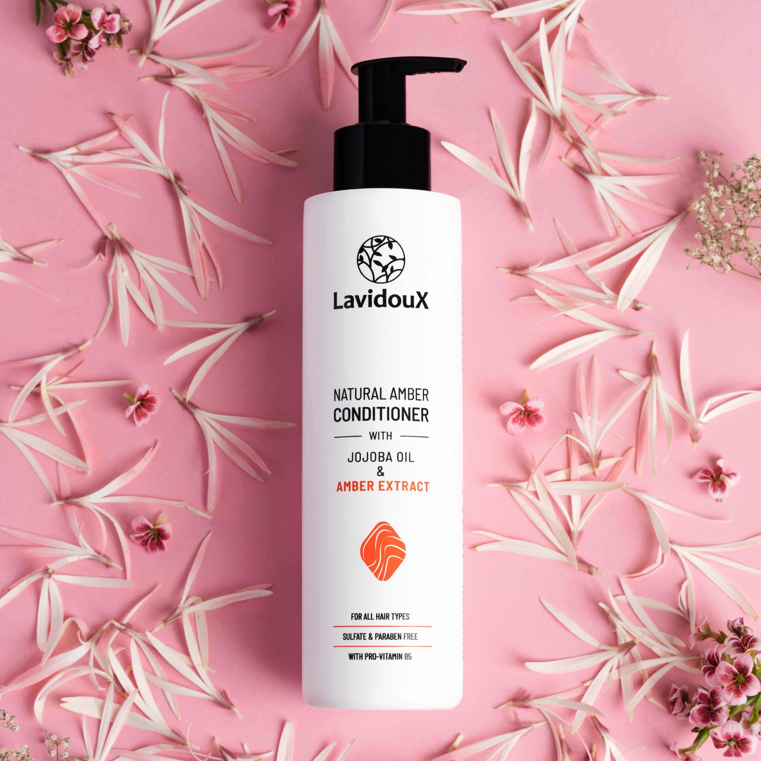 Amber Conditioner bottle with natural ingredients, showcasing its moisturizing properties.