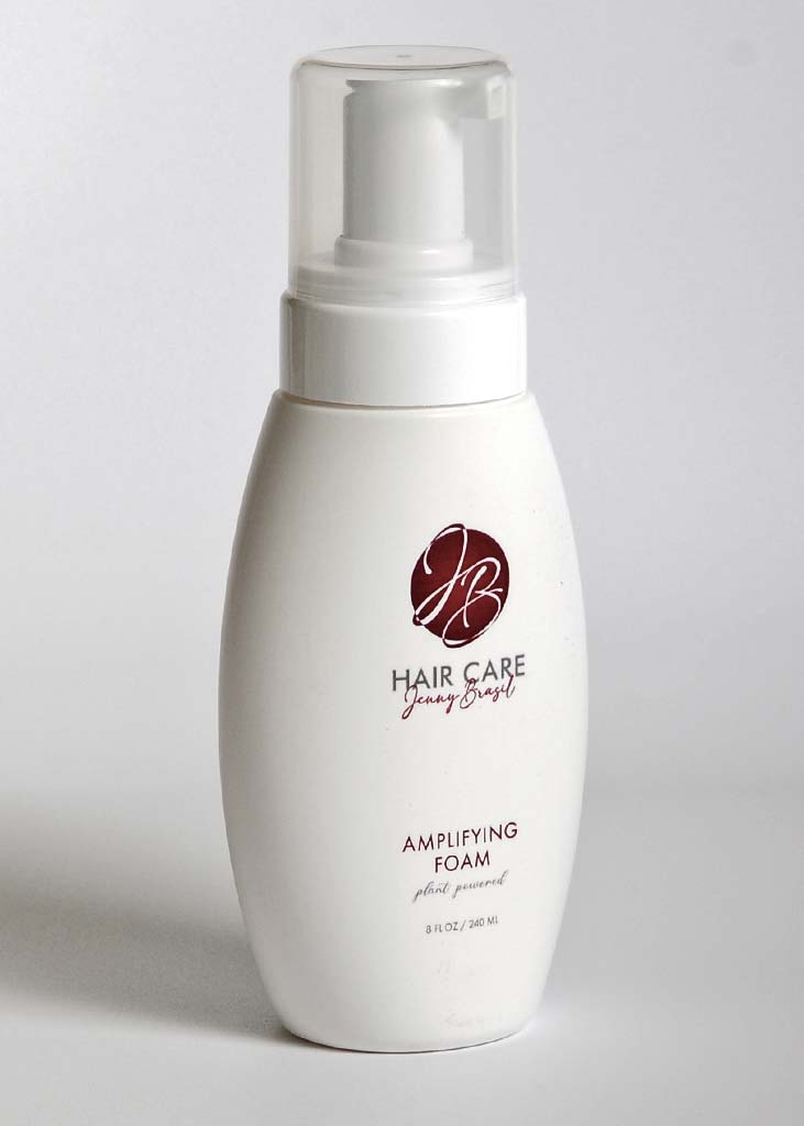 A bottle of Amplifying Foam with a sleek design, showcasing its lightweight formula for boosting hair volume.