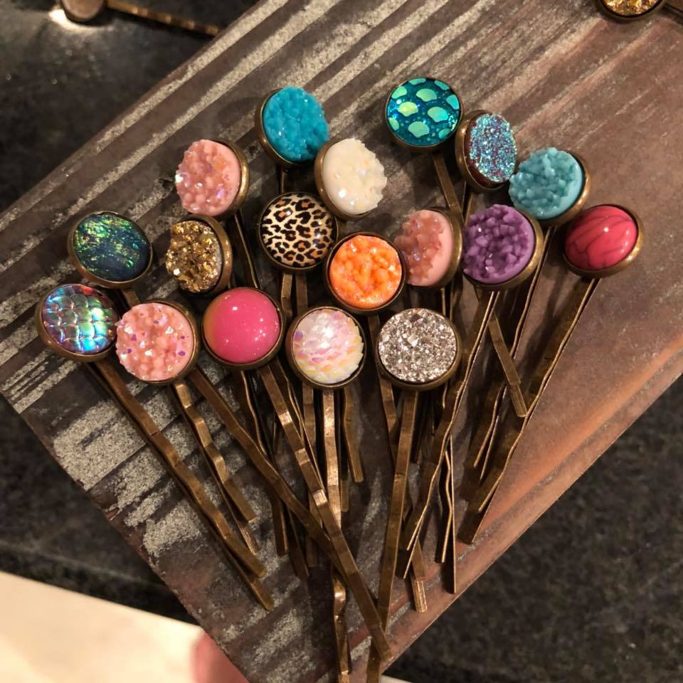 A collection of assorted druzy bobby pins in random colors, featuring elegant bronze finishes, perfect for stylish hair accessories.