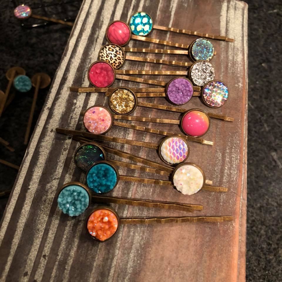 A collection of assorted druzy bobby pins in random colors, featuring elegant bronze finishes, perfect for stylish hair accessories.