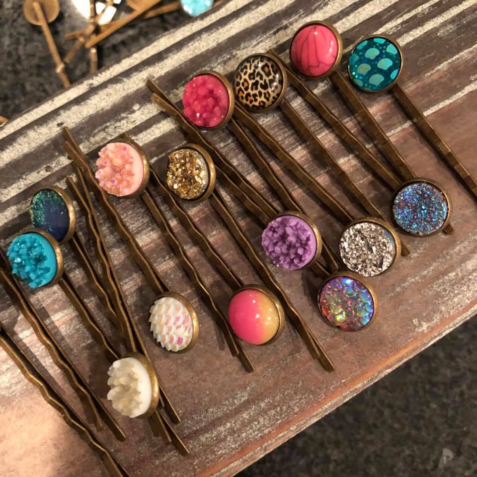 A collection of assorted druzy bobby pins in random colors, featuring elegant bronze finishes, perfect for stylish hair accessories.