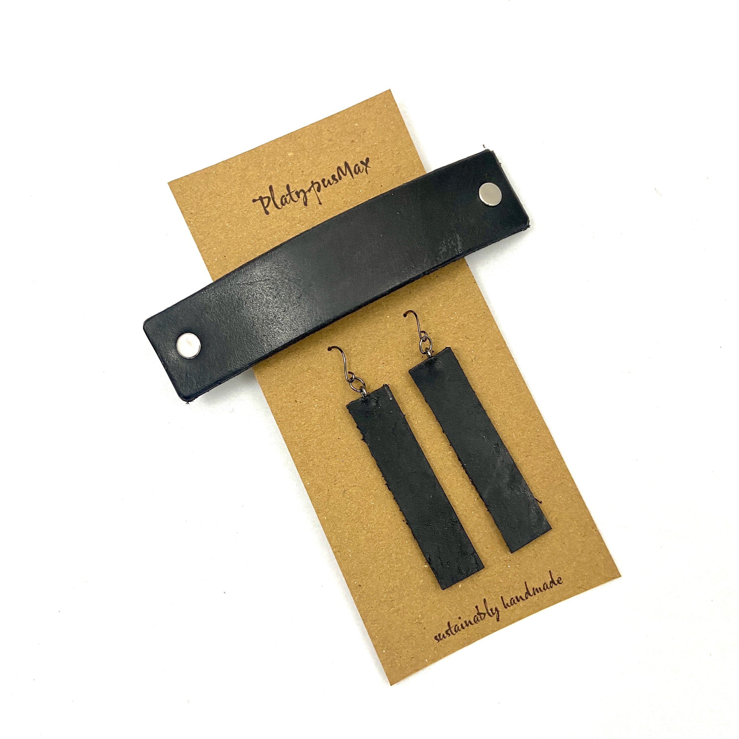 Basic Black Upcycled Leather Barrette and Earring Gift Set featuring dark gunmetal hardware, showcasing sustainable fashion accessories.