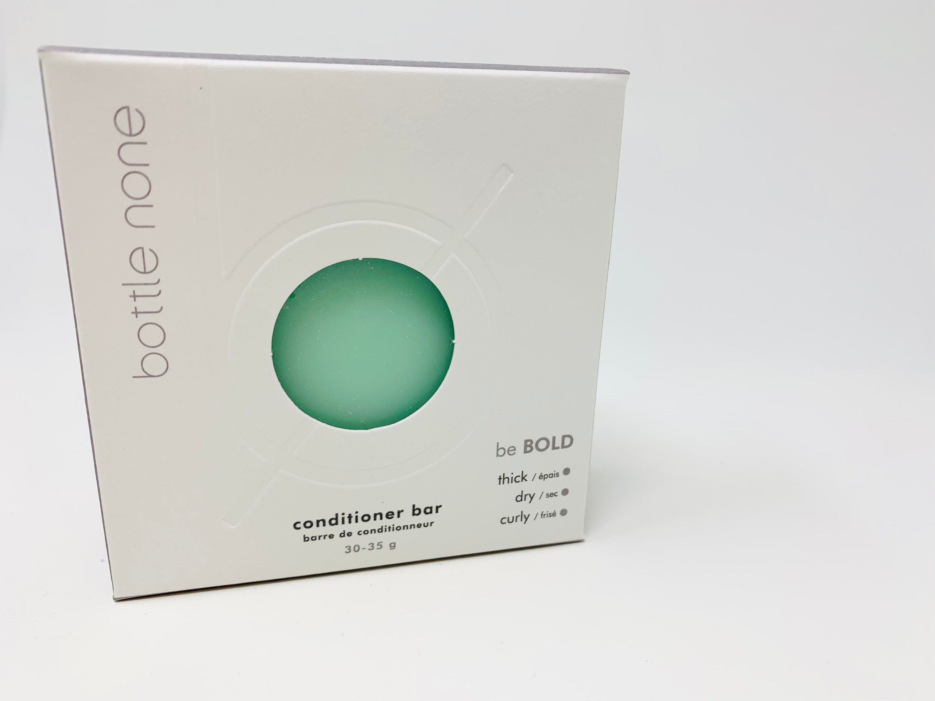 be BOLD Conditioner Bar in a stylish box, designed for curly and dry hair, showcasing its natural ingredients and eco-friendly packaging.