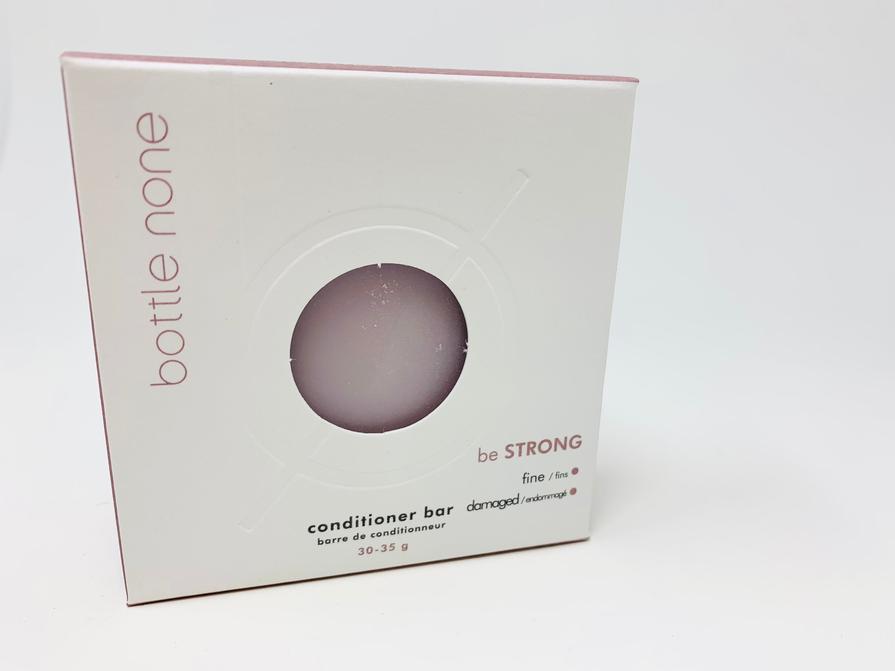 be STRONG Conditioner Bar in a stylish box, showcasing its eco-friendly design and natural ingredients for hair care.