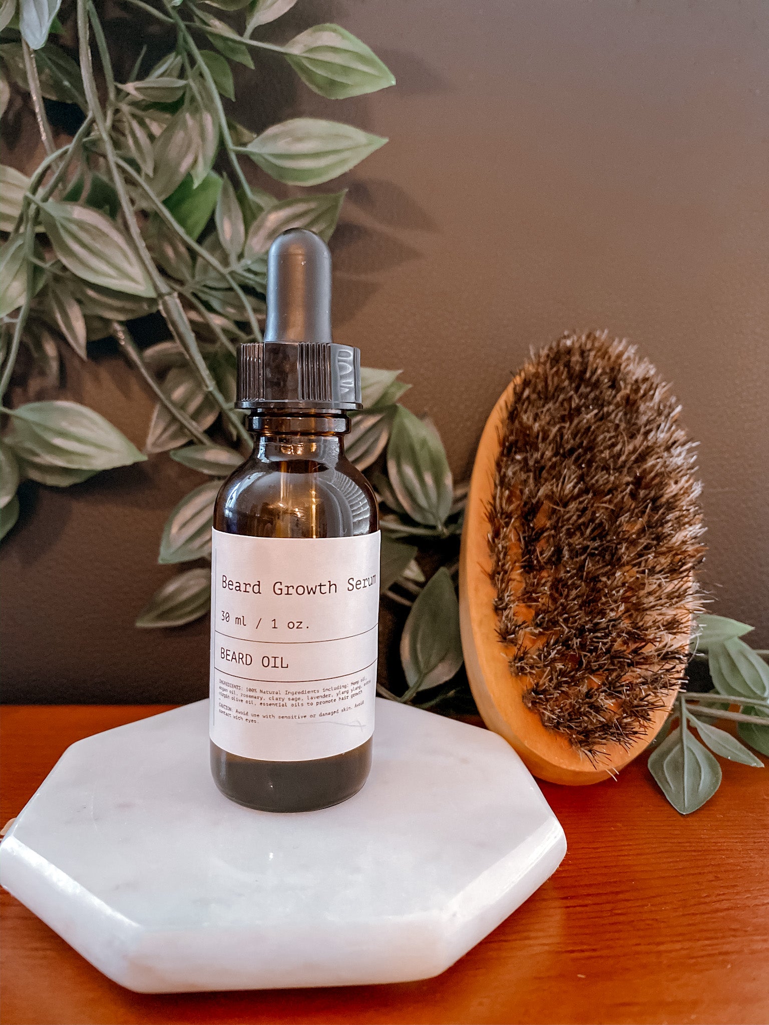 A bottle of Modern Man Beard Company Beard Growth Oil with a dropper, showcasing its premium all-natural ingredients for beard growth.