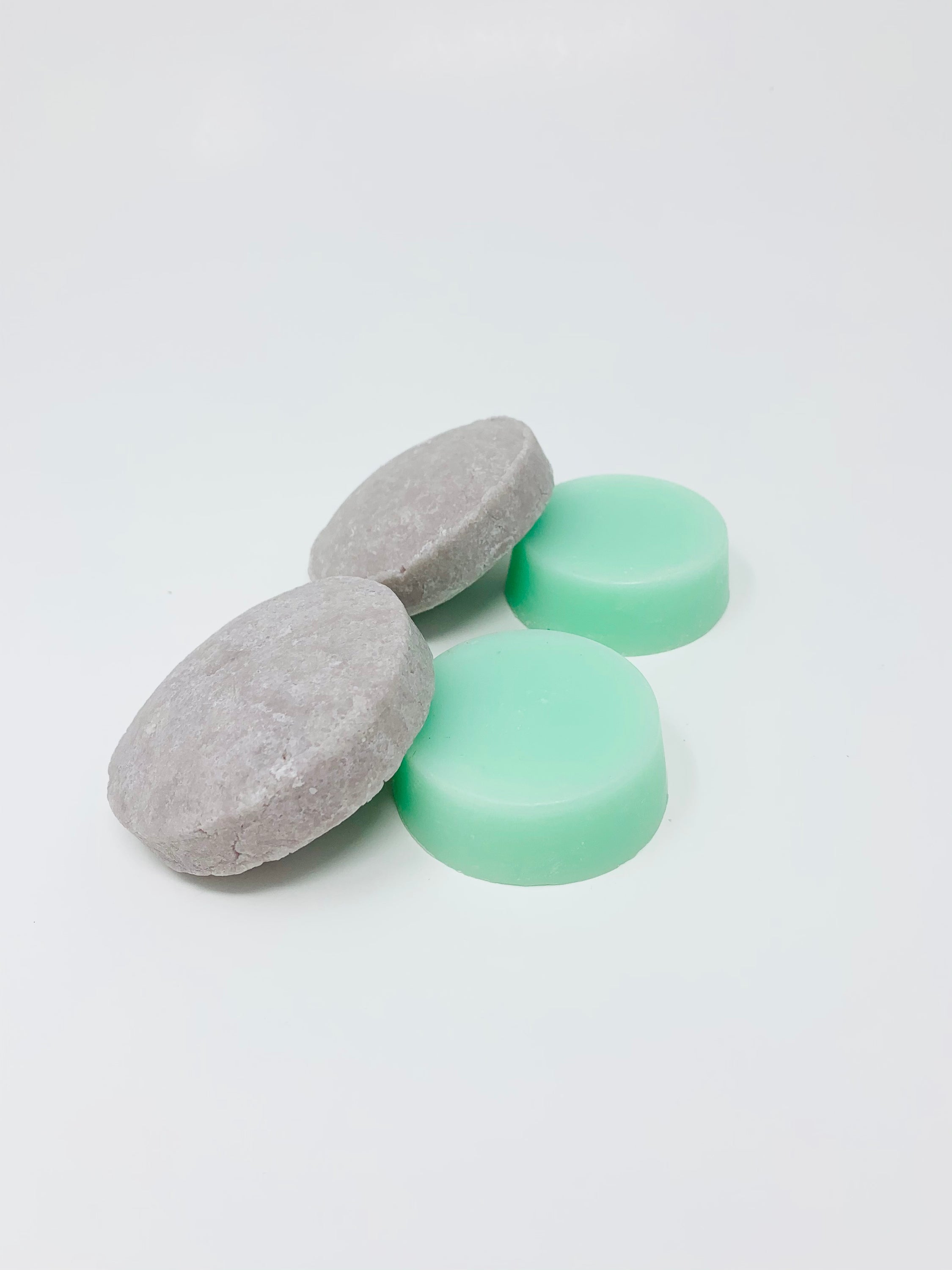 beBOLD Bundles featuring eco-friendly shampoo and conditioner bars for curly or dry hair, displayed with low waste packaging.