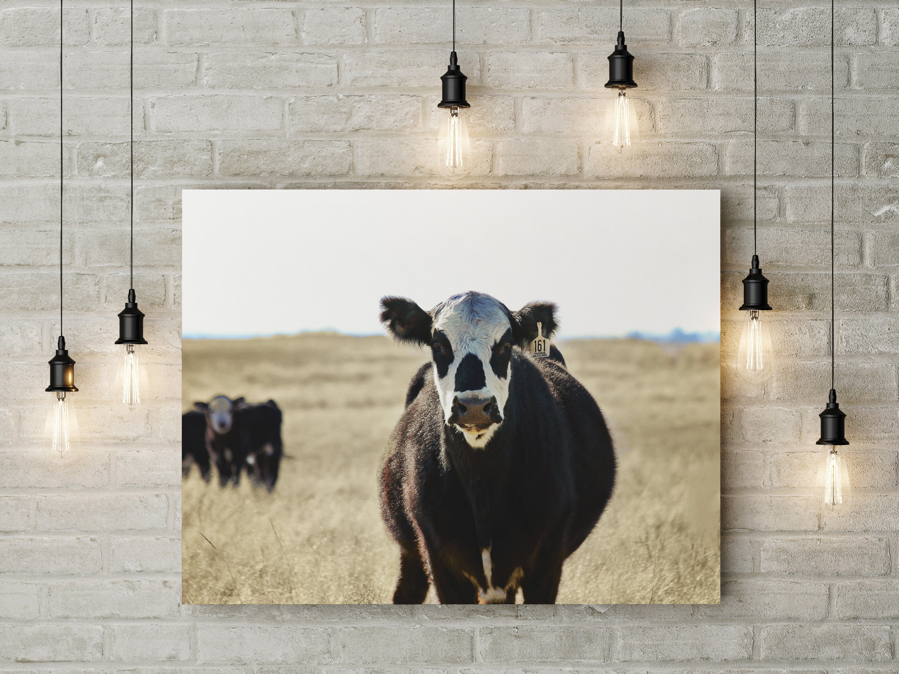 A beautiful canvas wall art featuring a detailed cow portrait, showcasing its expressive eyes and textured fur.