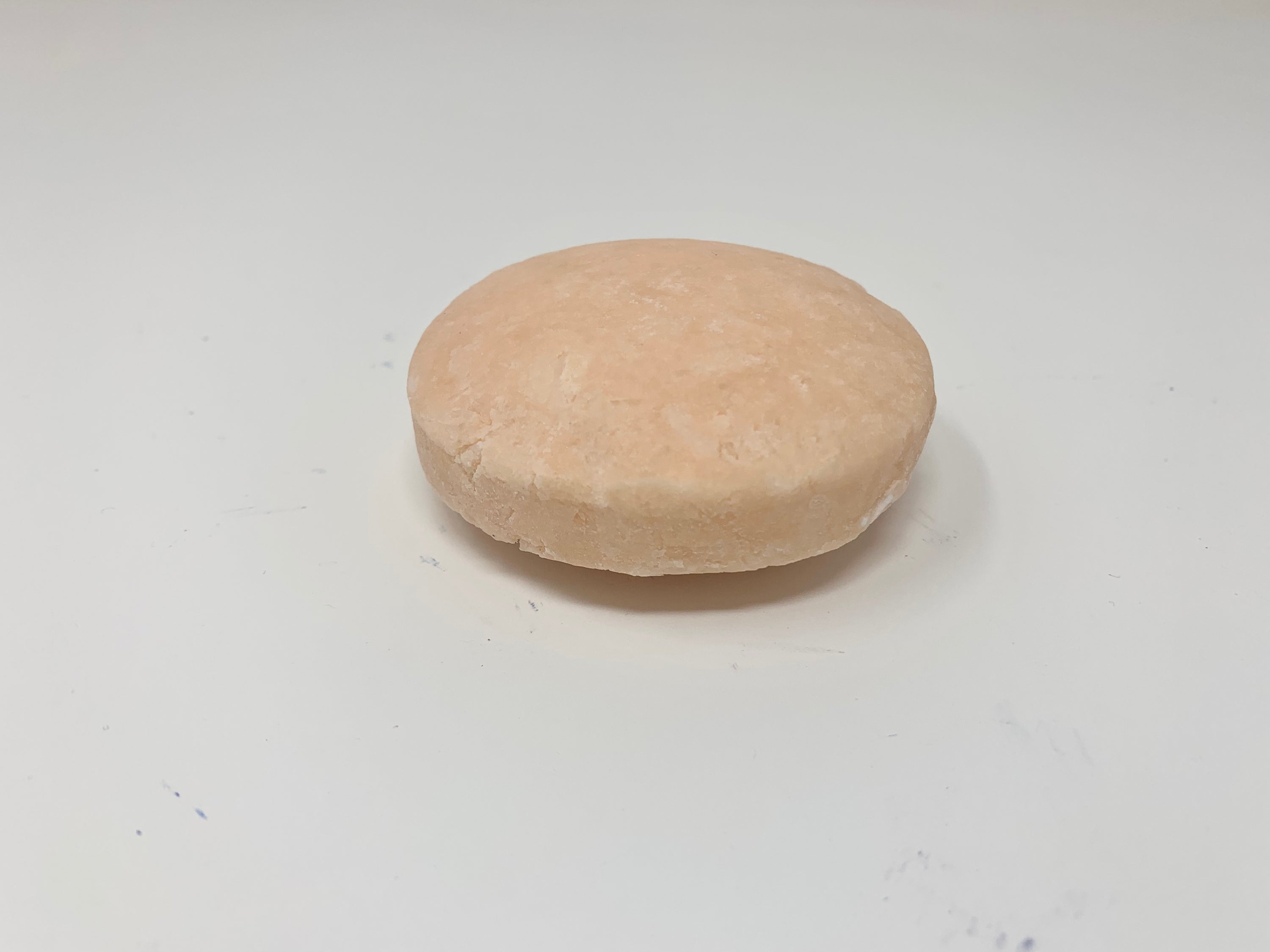 CLARIFY detoxifying shampoo bar with bright citrus scent, designed to remove buildup and residue from hair and scalp.