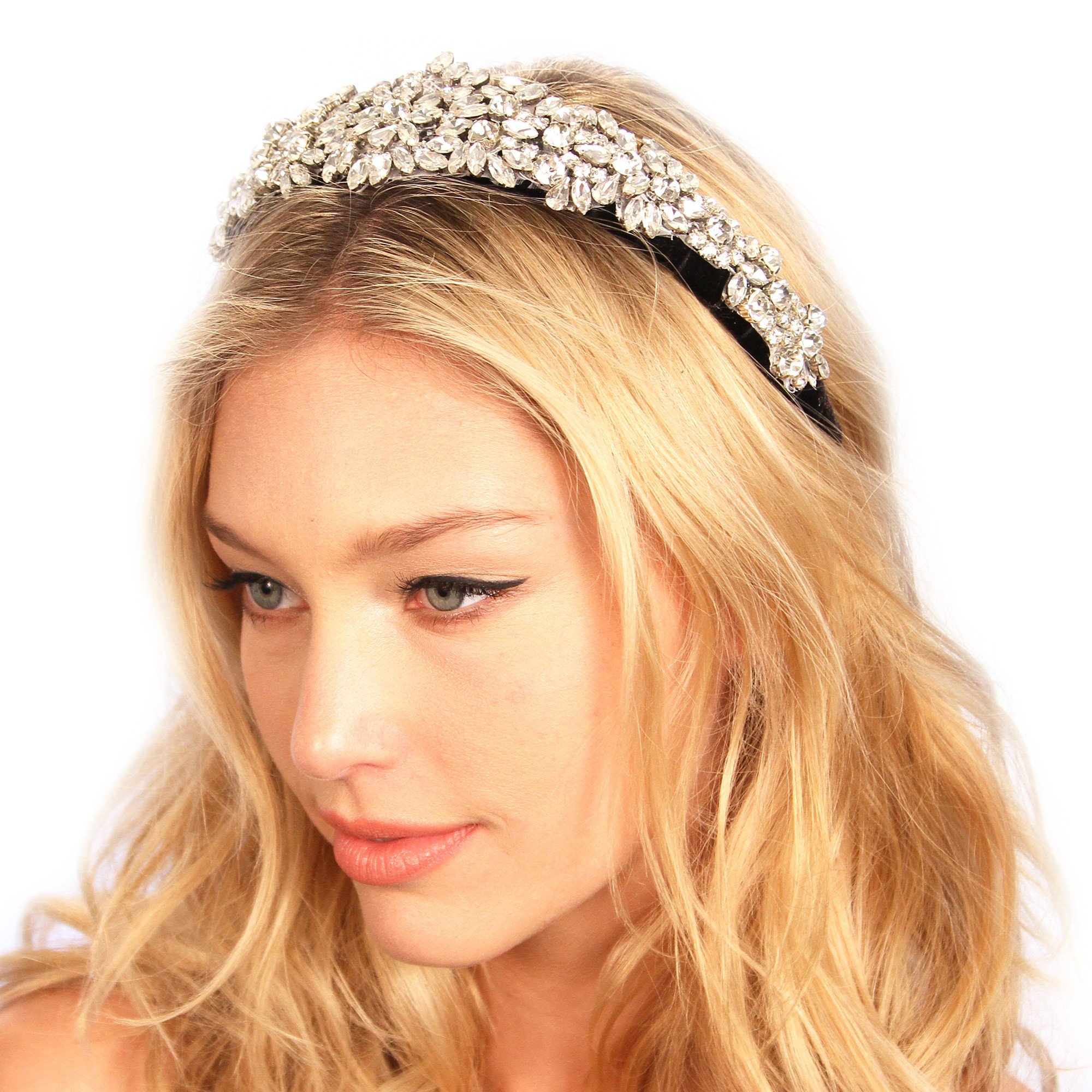 A luxurious velvet headband adorned with sparkling glass rhinestones, showcasing its elegant design and padded comfort.