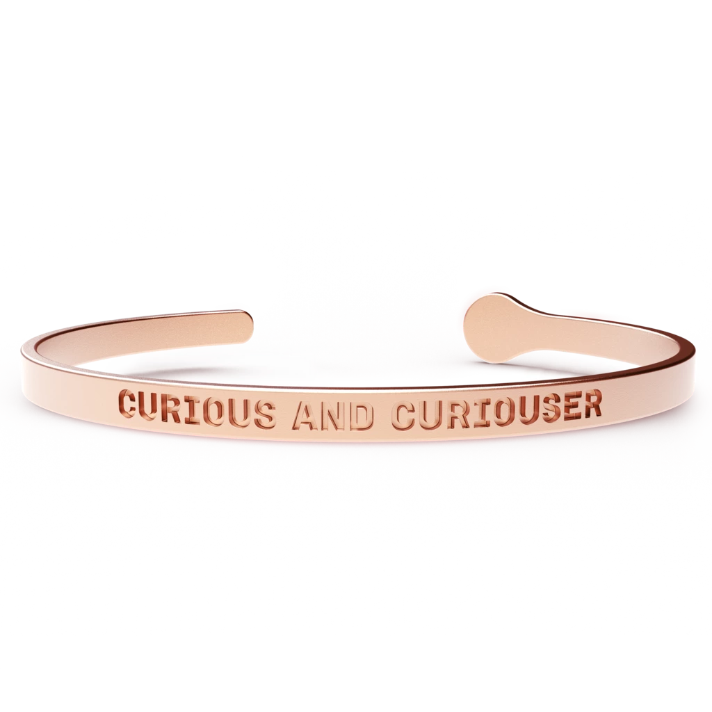 A stylish CURIOUS AND CURIOUSER bracelet made of stainless steel with a 24k gold coating, designed to fit most wrist sizes.