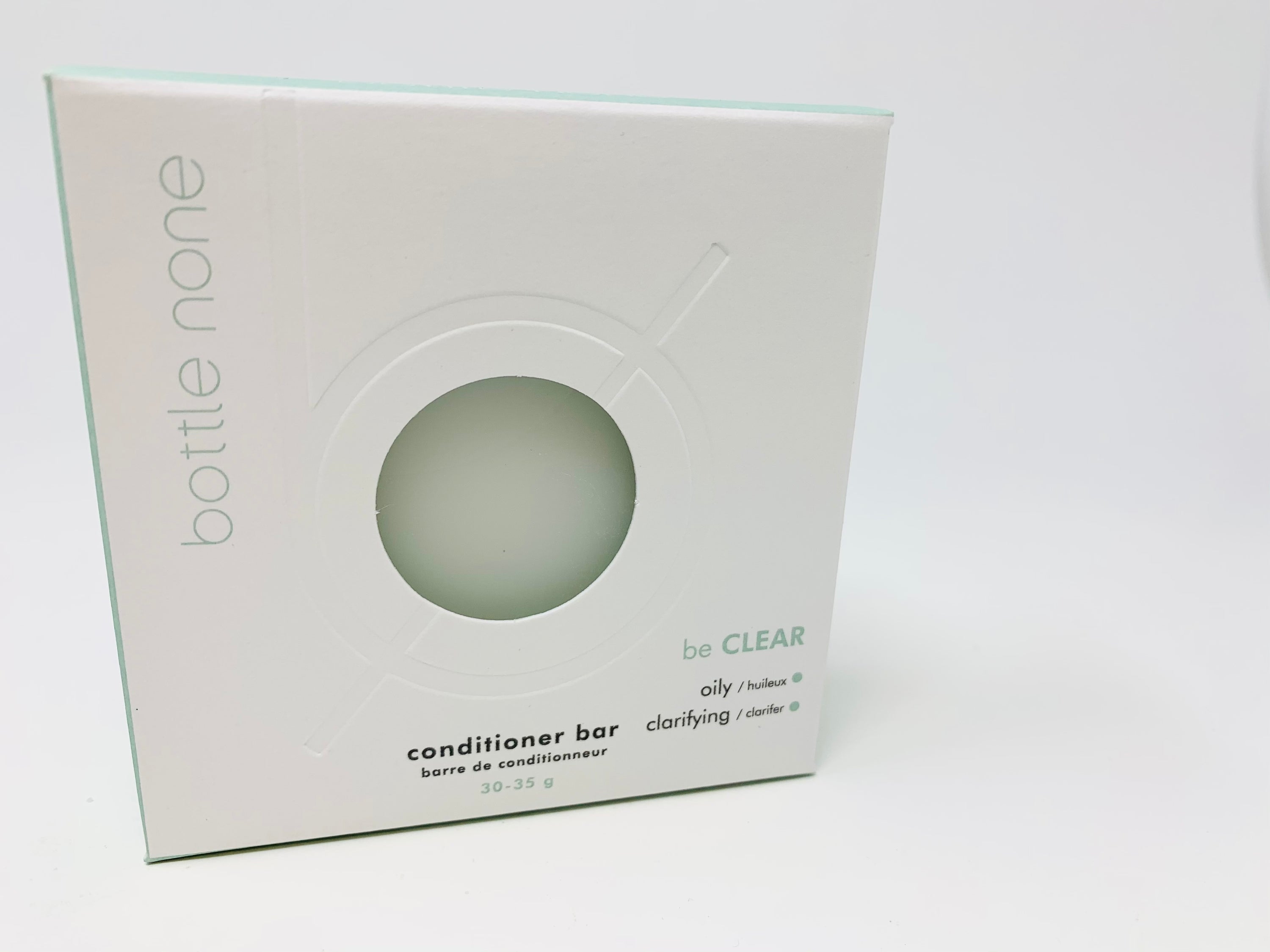 be CLEAR Conditioner Bar in a boxed packaging, designed for oily scalps with natural ingredients.