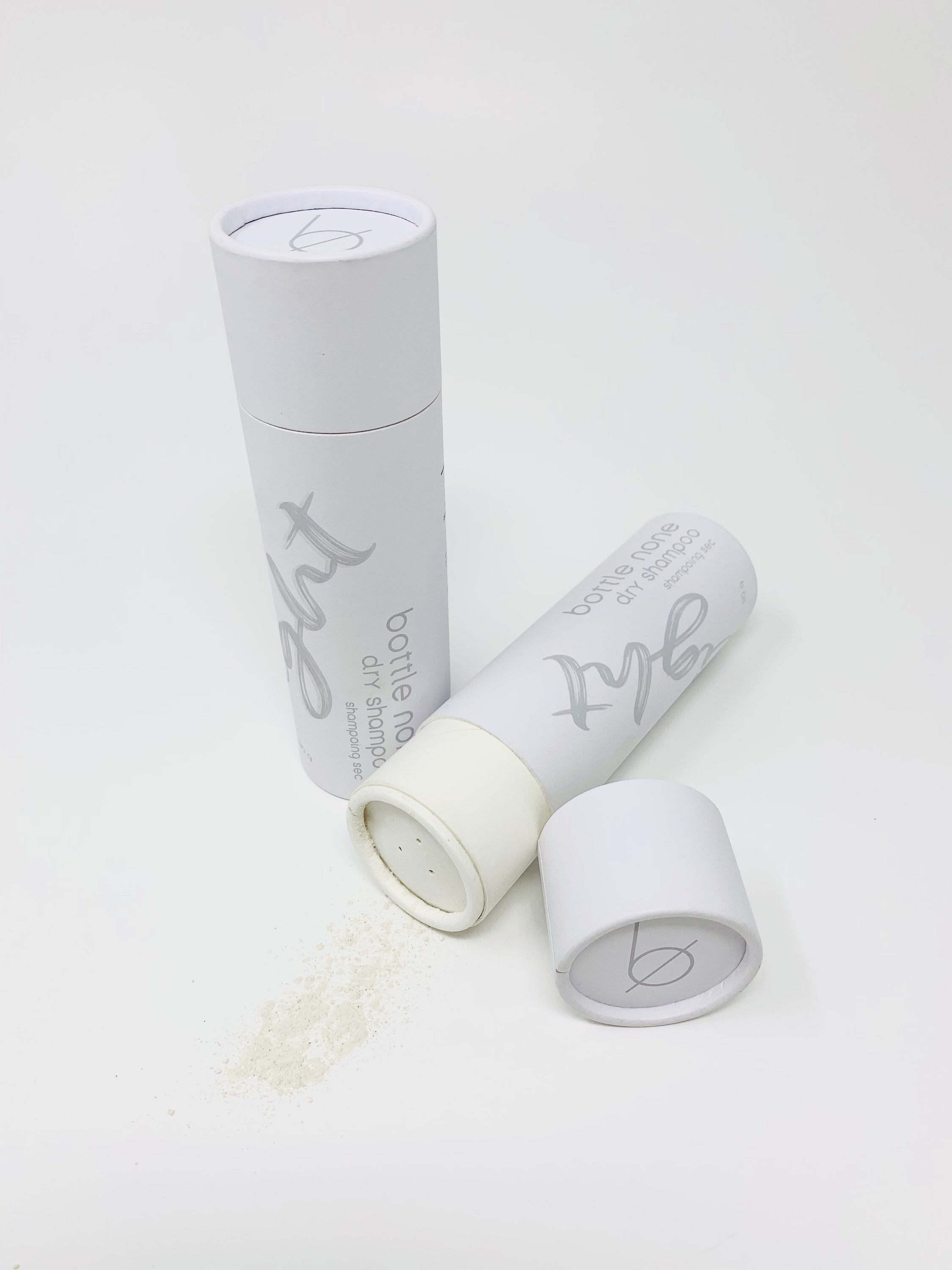 A 90g tube of Light Dry Shampoo with a powder formula for absorbing excess oil, featuring natural ingredients.