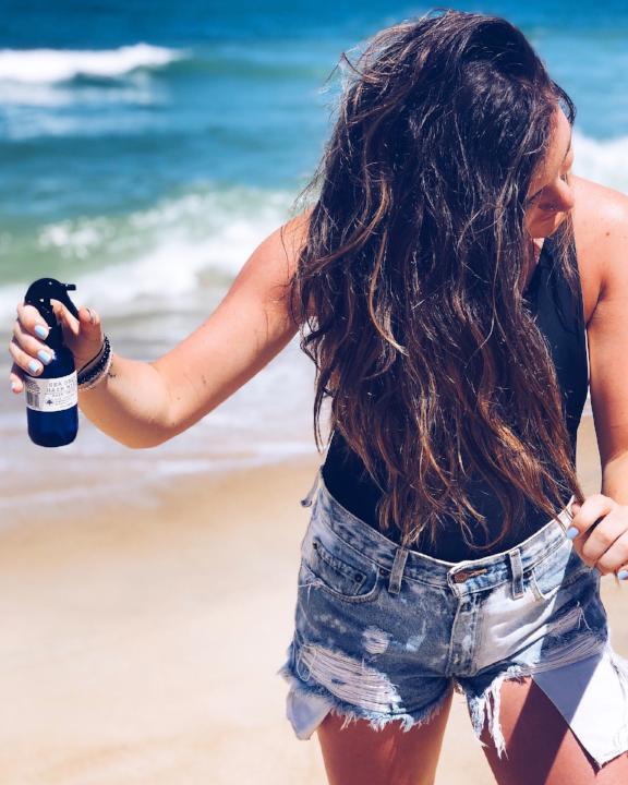 East Falls Sea Salt Hair Mist in a glass bottle with a refreshing scent and natural ingredients for beachy waves.