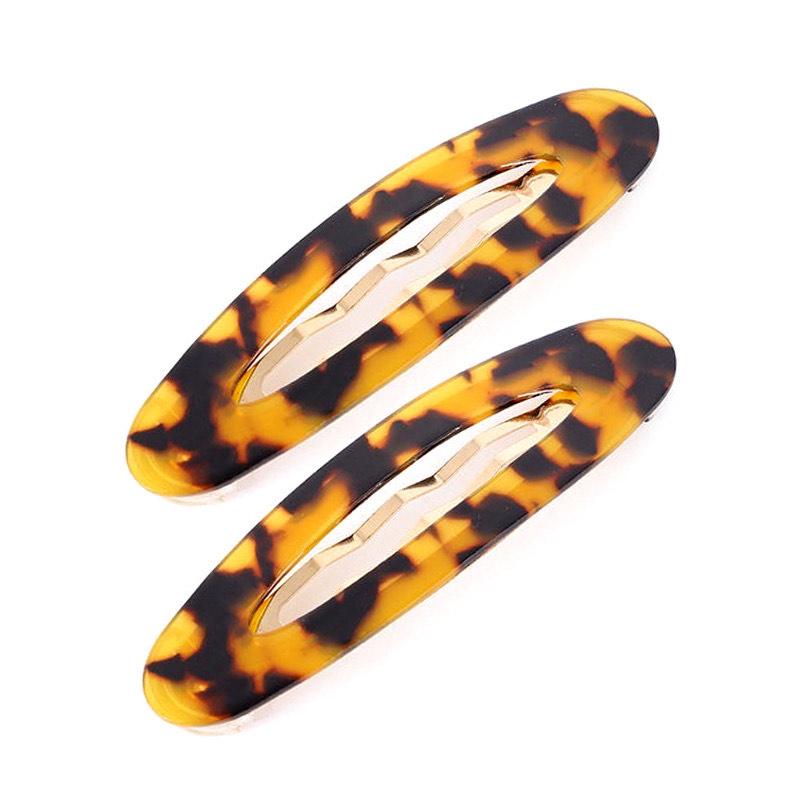 Set of 2 large essential snap clips in matching colors, made from eco-friendly acetate, showcasing their stylish design and secure grip.