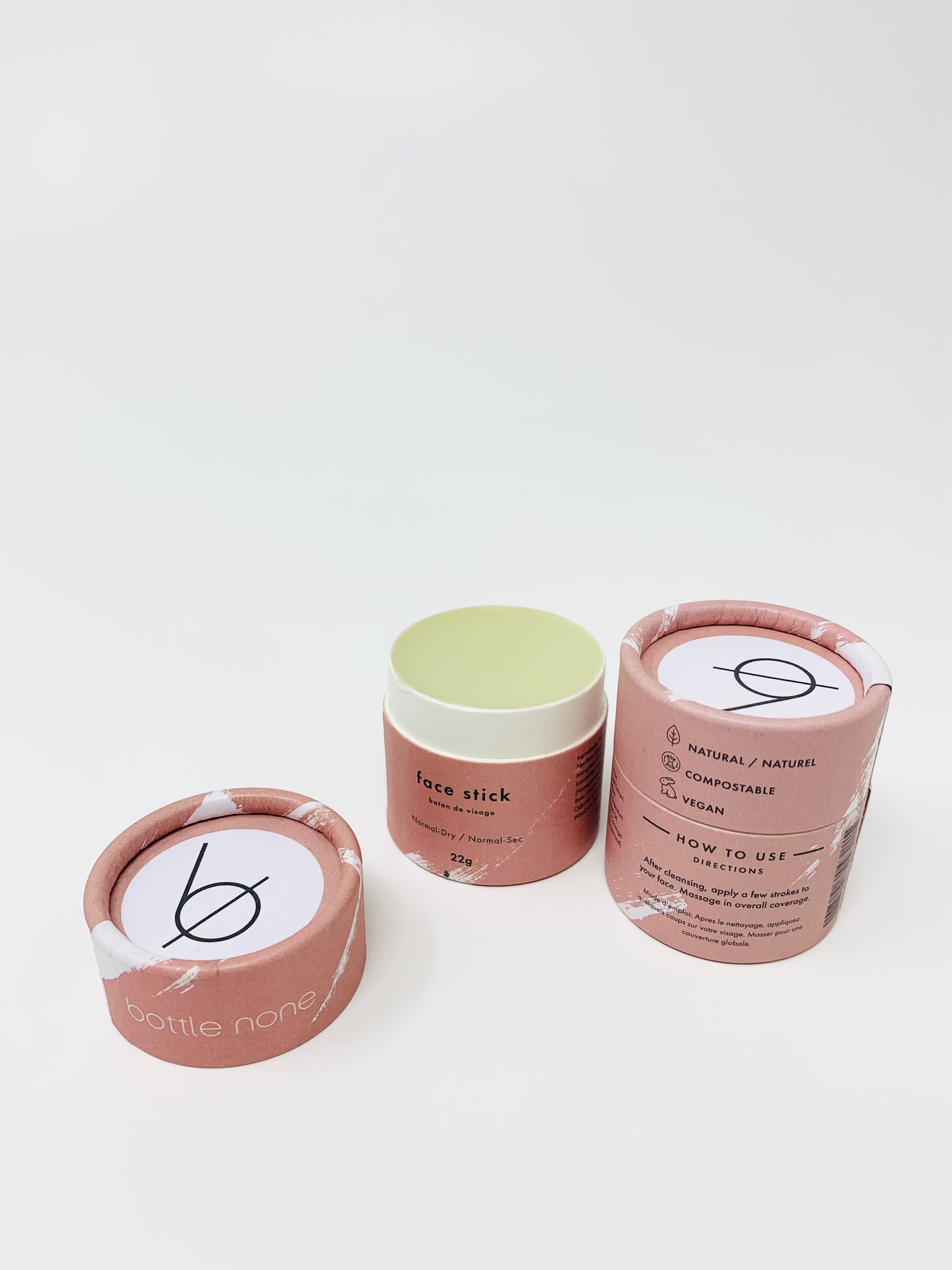 A close-up of the Face Stick for normal to dry skin, showcasing its eco-friendly packaging and smooth texture.