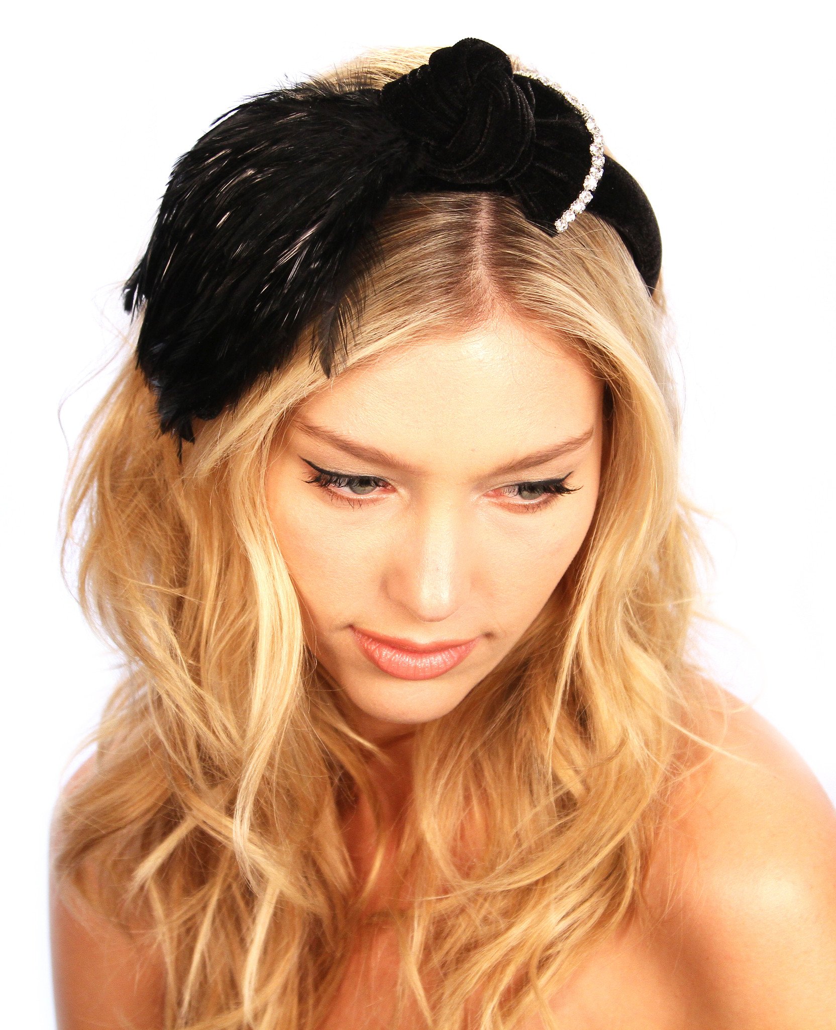 Feathered Bow Headband featuring plush black velvet, a knotted bow, and sparkling glass crystal rhinestones, perfect for elegant outfits.