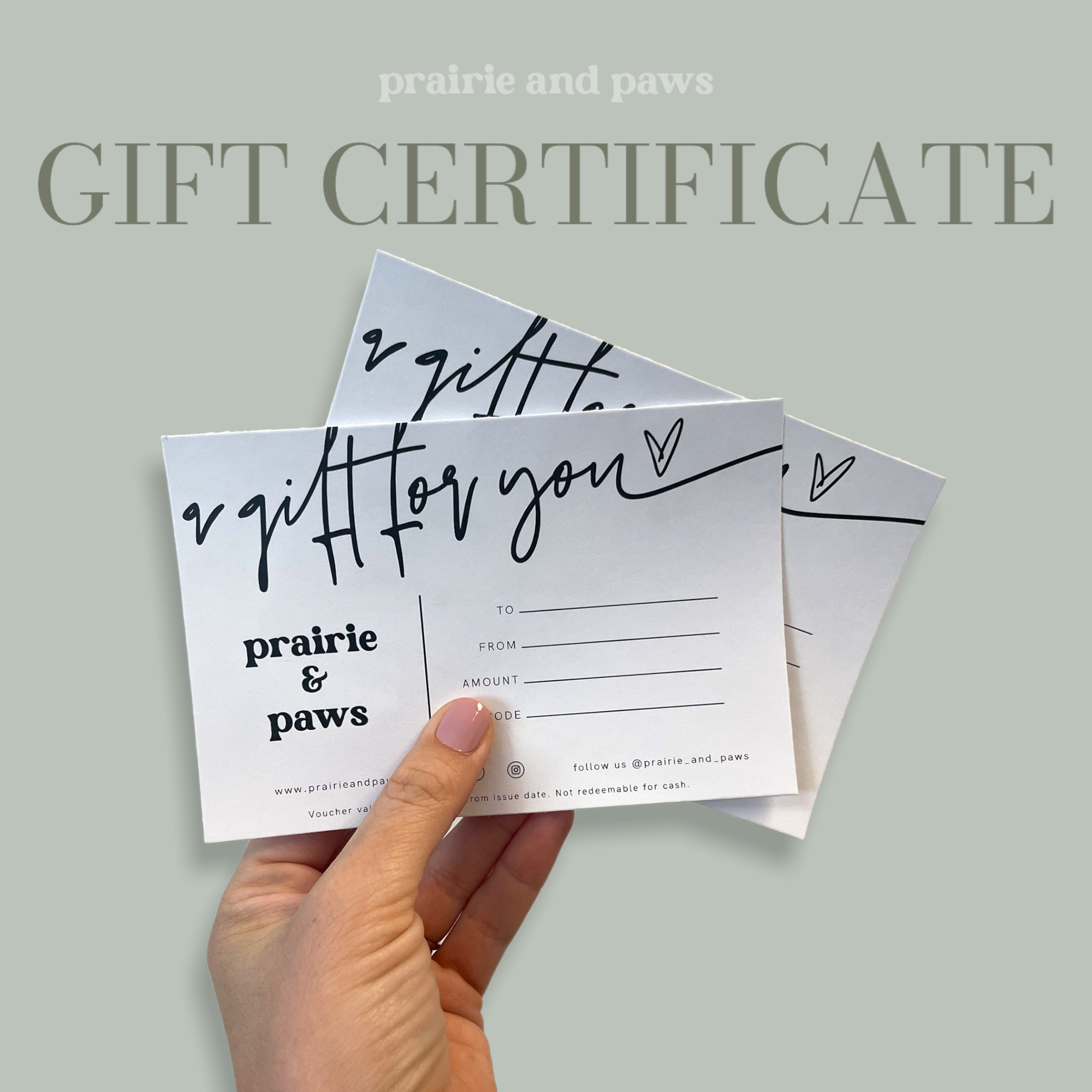 Prairie and Paws gift certificate displayed on a wooden table with pet-themed decorations.