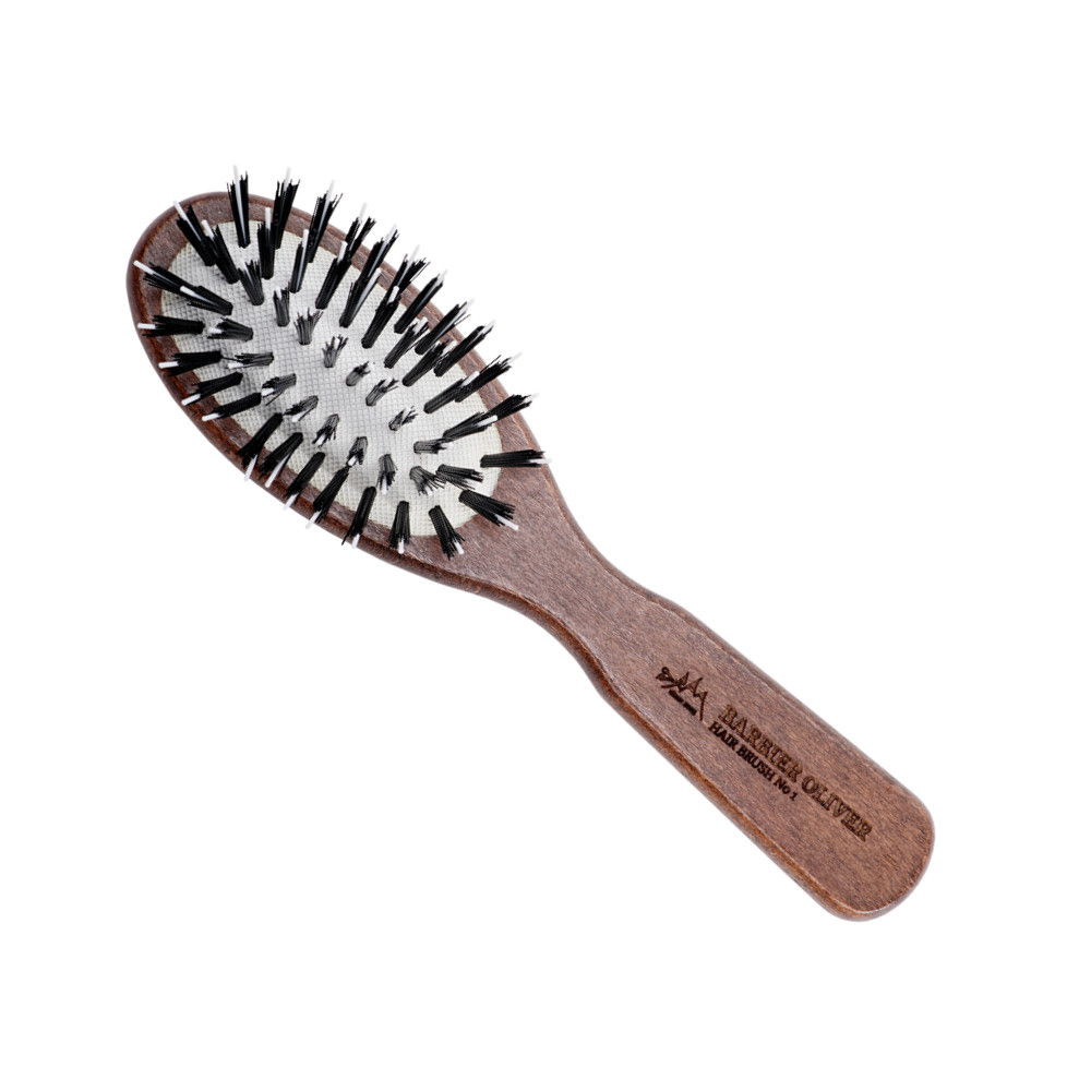 Hair Brush No. 01, a small wooden detangling brush designed for smooth hair, ideal for travel and children.