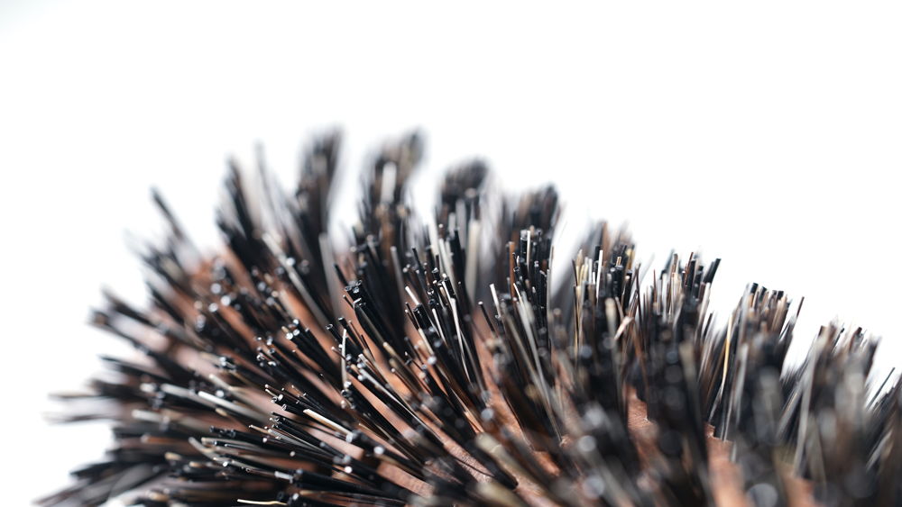 Hair Brush No. 12 featuring natural boar bristles and a 60mm round design, perfect for professional and everyday hair styling.