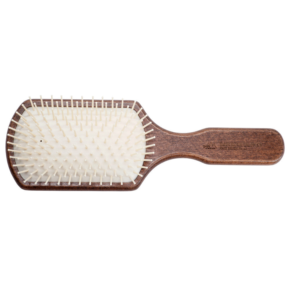 Hair Brush No. 22, a professional wooden pneumatic brush designed for all hair types, featuring a rounded design for gentle detangling.