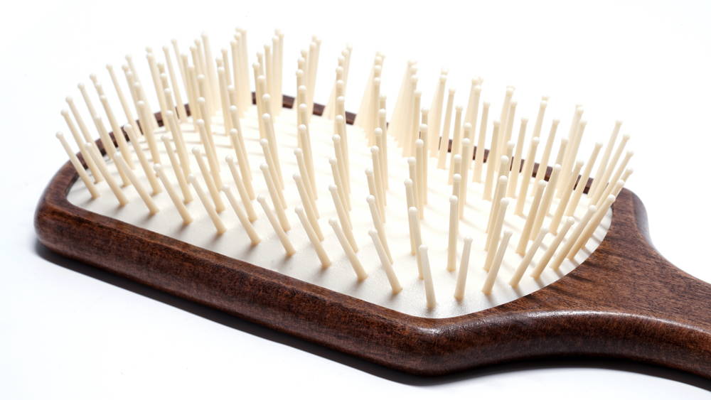 Hair Brush No. 22, a professional wooden pneumatic brush designed for all hair types, featuring a rounded design for gentle detangling.