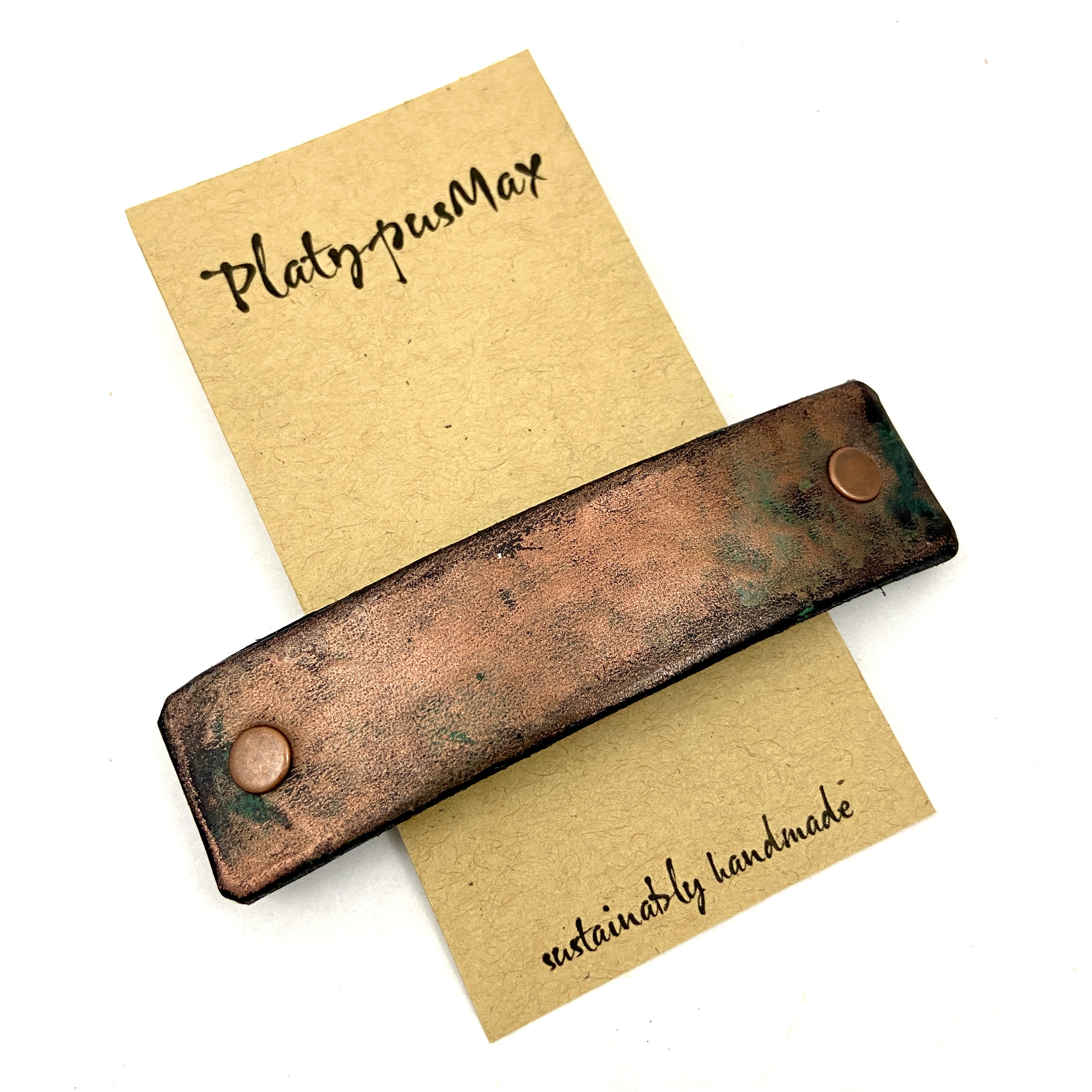 Hammered Antique Copper Leather Barrette featuring embossed leaf print in rich purple-red leather with metallic finish.