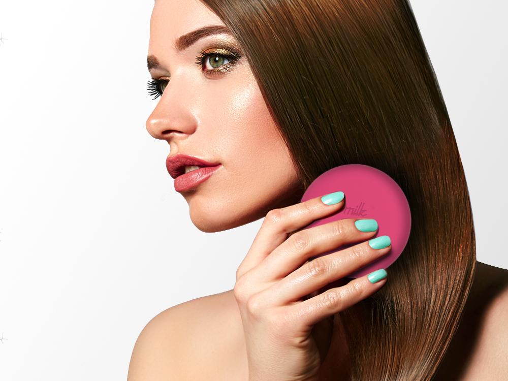 A stylish macaron for hair® travel hairbrush with a pop-off cover and integrated mirror, designed for easy detangling and portability.