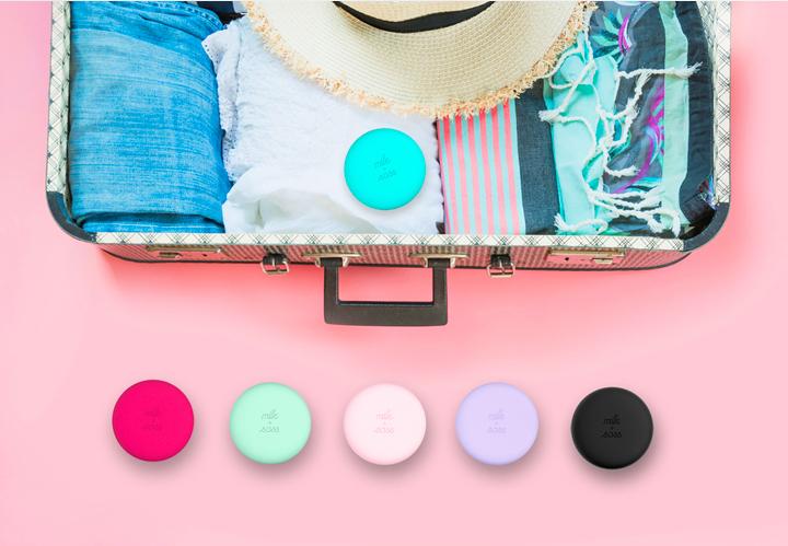 A stylish macaron for hair® travel hairbrush with a pop-off cover and integrated mirror, designed for easy detangling and portability.