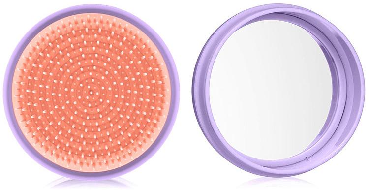 A stylish macaron for hair® travel hairbrush with a pop-off cover and integrated mirror, designed for easy detangling and portability.