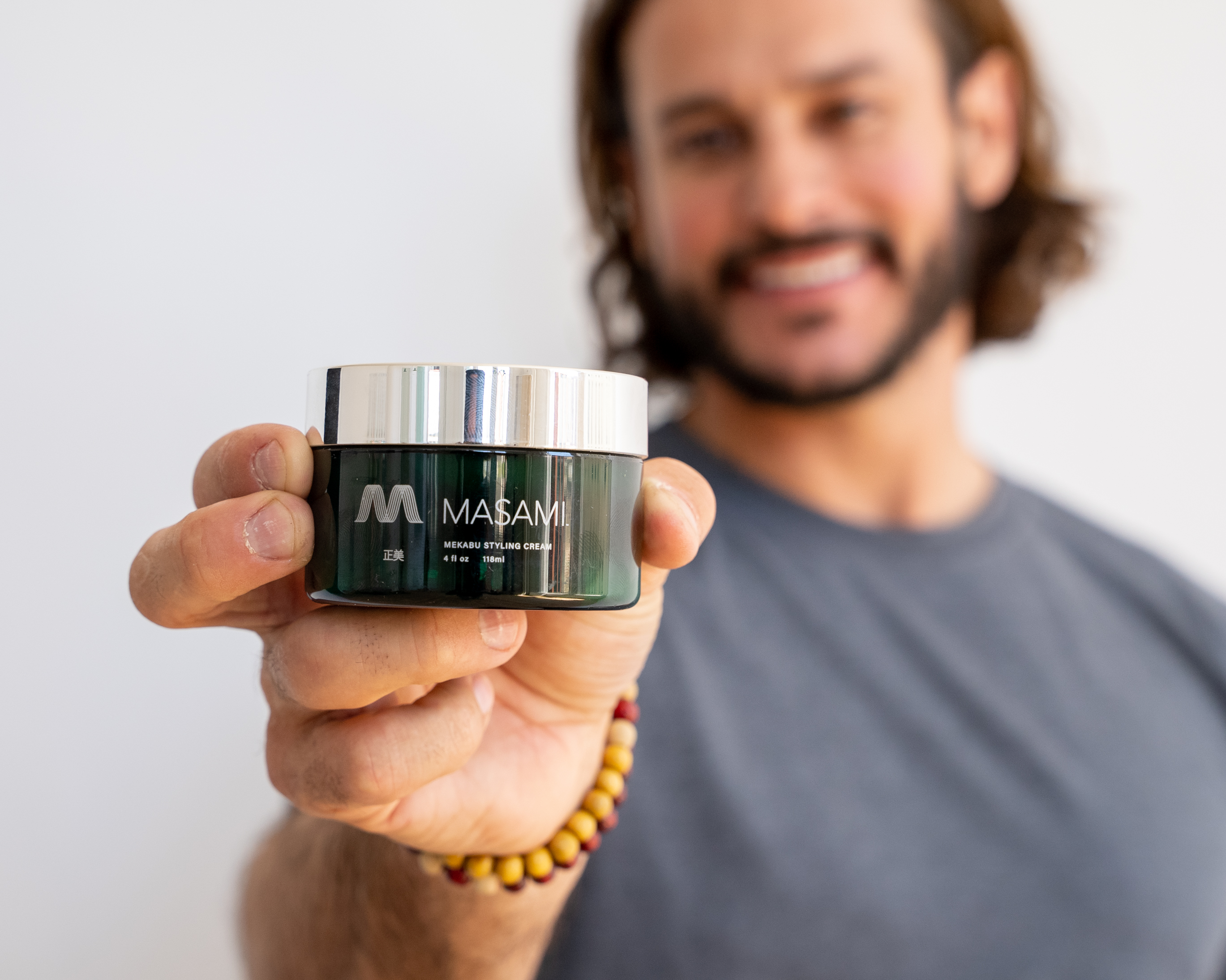 Mekabu Hydrating Styling Cream in a sleek container, showcasing its lightweight texture and hydrating properties.