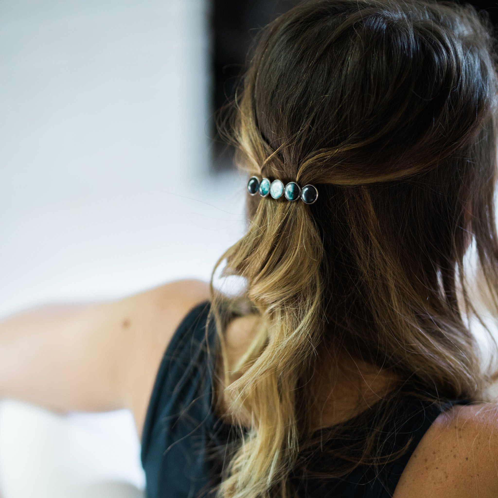 Moon Phase Hair Clip Barrette featuring five distinct moon phases, handcrafted from rhodium plated brass and glass, measuring 2.5 inches long.