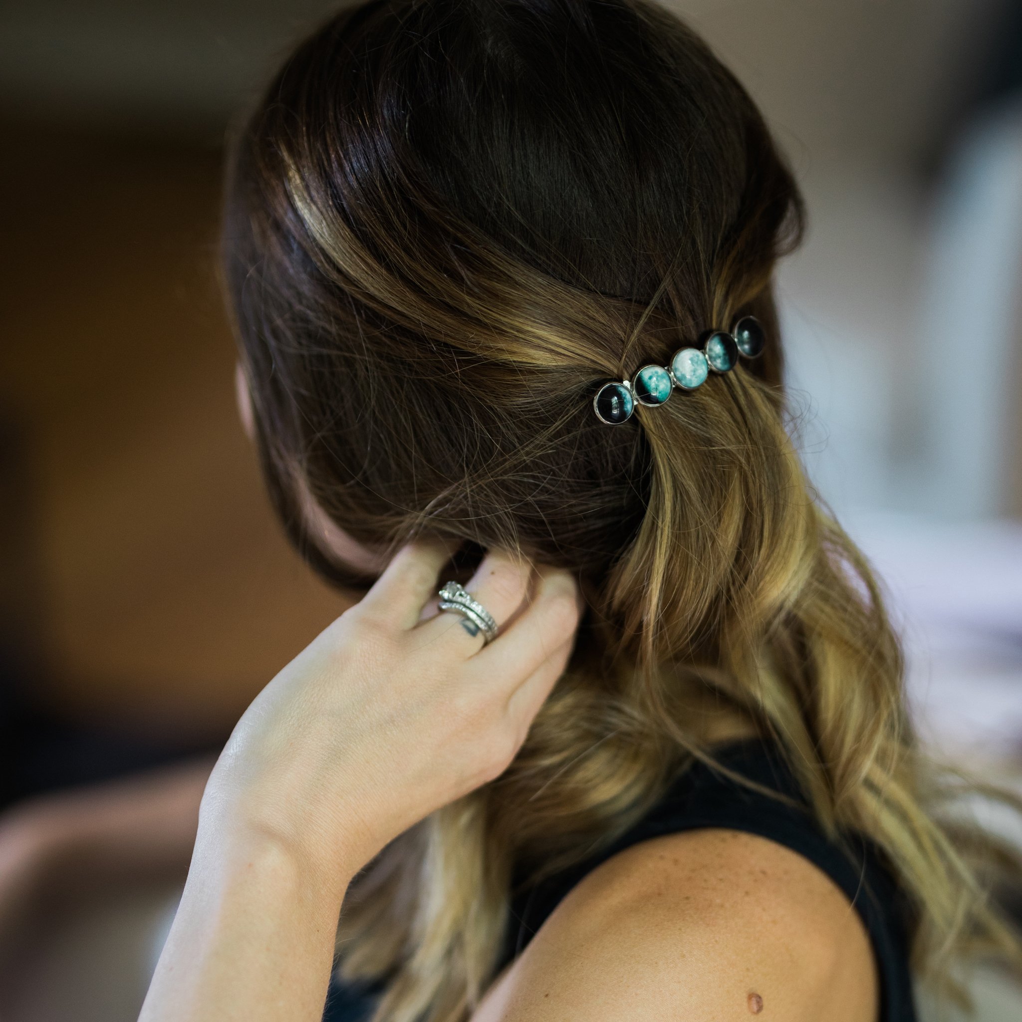 Moon Phase Hair Clip Barrette featuring five distinct moon phases, handcrafted from rhodium plated brass and glass, measuring 2.5 inches long.